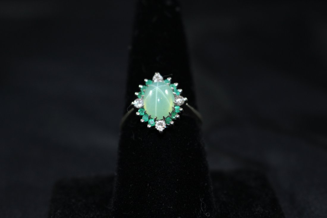 14kt YG EMERALD & DIAMOND RING: SIGNED 14kt ,approximately 1/2 ct of emeralds with 4 small round white diamonds and 1 ct cabochon emerald center stone from a prominent Boca Raton estate, shipping U.S.$20 plus ins SIZE 5