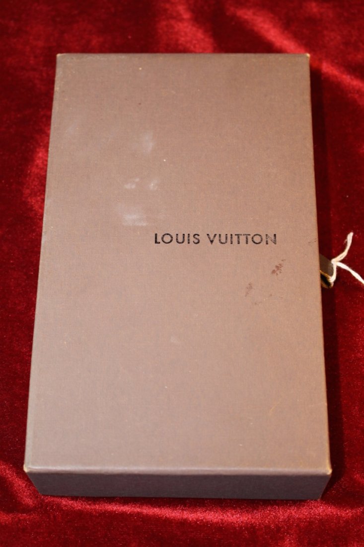 LOUIS VUITTON NEW IN BOX LADIES WALLET: Measures 7" long, comes with original box and sleeve, also papers, shipping $20 plus Ins
