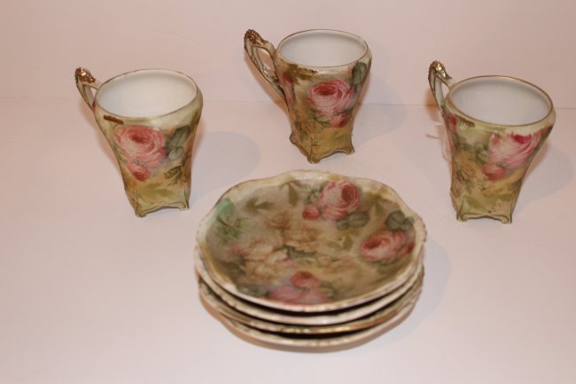 ANTIQUE ROYAL BAYREUTH ROSE TAPESTRY CUPS&SAUCERS: Lot consists of three cups and four saucers. Each bear the blue makers mark to base. Circa early 20th century. Each cup measures approximately 4" Tall. Shipping U.S. $40 plus insurance. Condition: One