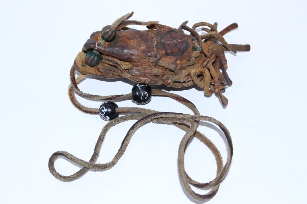 AMERICAN INDIAN 19TH CENTURY LEATHER MEDICINE BAG: Holds the original stones, 4" in length, leather in make up, from a northern plains Indian tribe. This is a medicine man's bag of magic stones, super rare and great find, shipping $20 plus ins U.S.