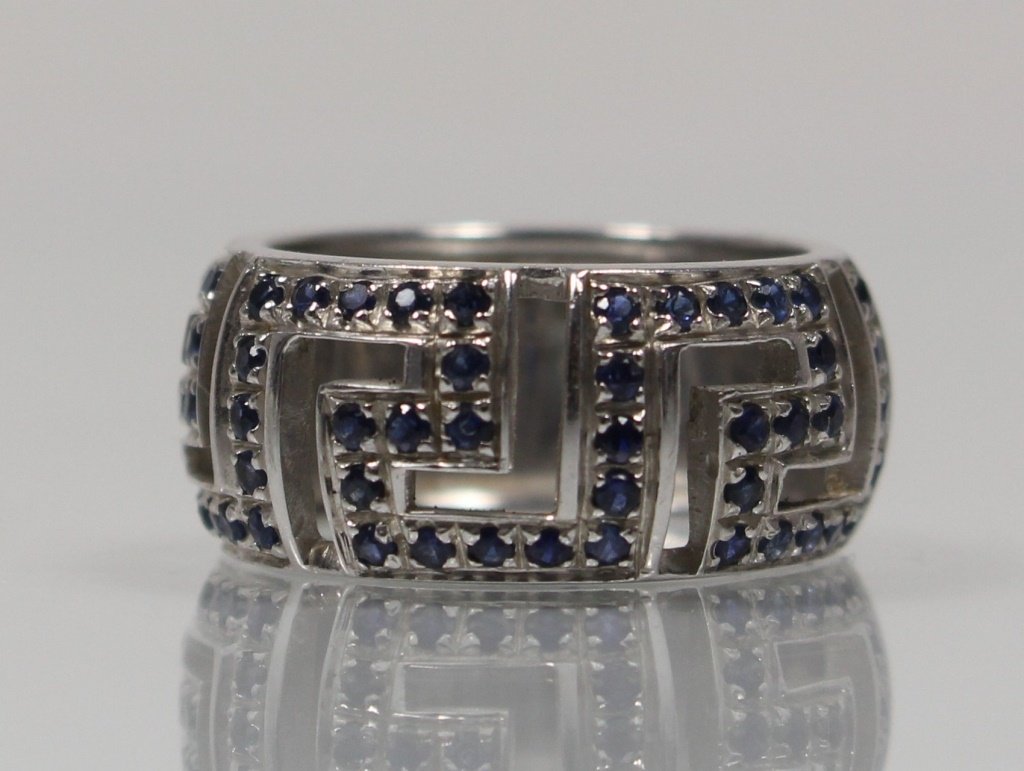 VERSACE 18KT WHITE GOLD & SAPPHIRE RING: Size 5. Signed inside. Total weight 7.8grams. Shipping $20 plus insurance.