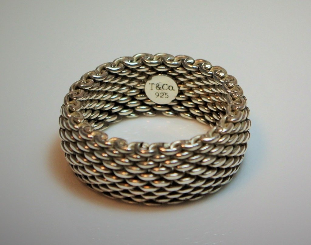 TIFFANY & CO. PLIABLE STERLING SILVER RING: Total weight 10 grams. Shipping $20 plus insurance.