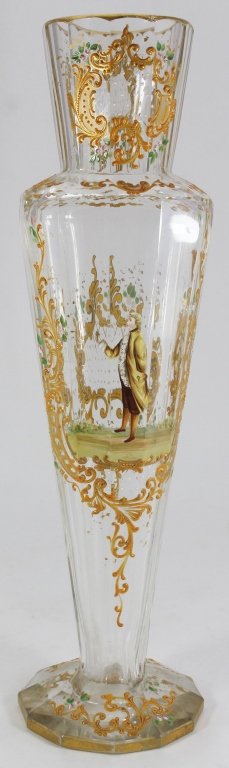 FRENCH TALL ENAMELED FLORAL DESIGN VASE: Gilt And Enamel Decorated Vase Has Faceted Clear Glass Body With Raised Gilt Scrolls Surrounding A Center Panel With A Colonial Era Gentleman Holding A Flower, Back Side Of Vase Decorated With Gilt Ca