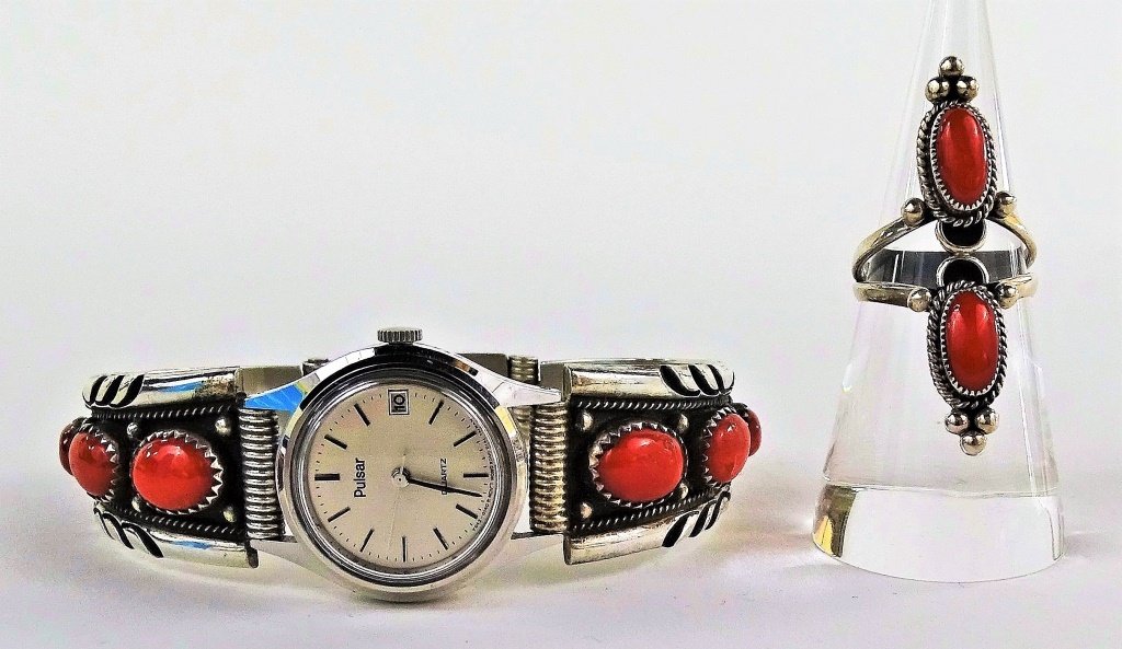 NAVAJO STERLING SILVER CORAL WATCH/RING SUITE: Pulsar quartz watch, stamped to inside, with matching 2 coral ring. Watch measures 8" diameter, ring size 6.5 Total weight 58.8 grams. Shipping $20 U.S. plus insurance.