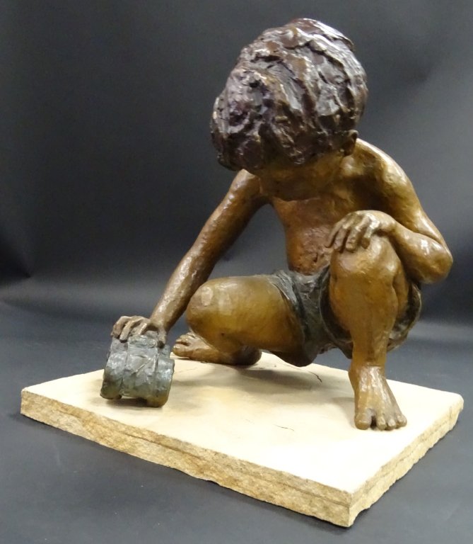 JANE DEDECKER LARGE BRONZE OF A BOY PLAYING: Jane DeDecker is known for sculptor-child figure and genre. Large bronze of a little boy playing with his toy bike on a stone base. Signed to right foot and numbered 19/21 1987. Measures approx 22" ta
