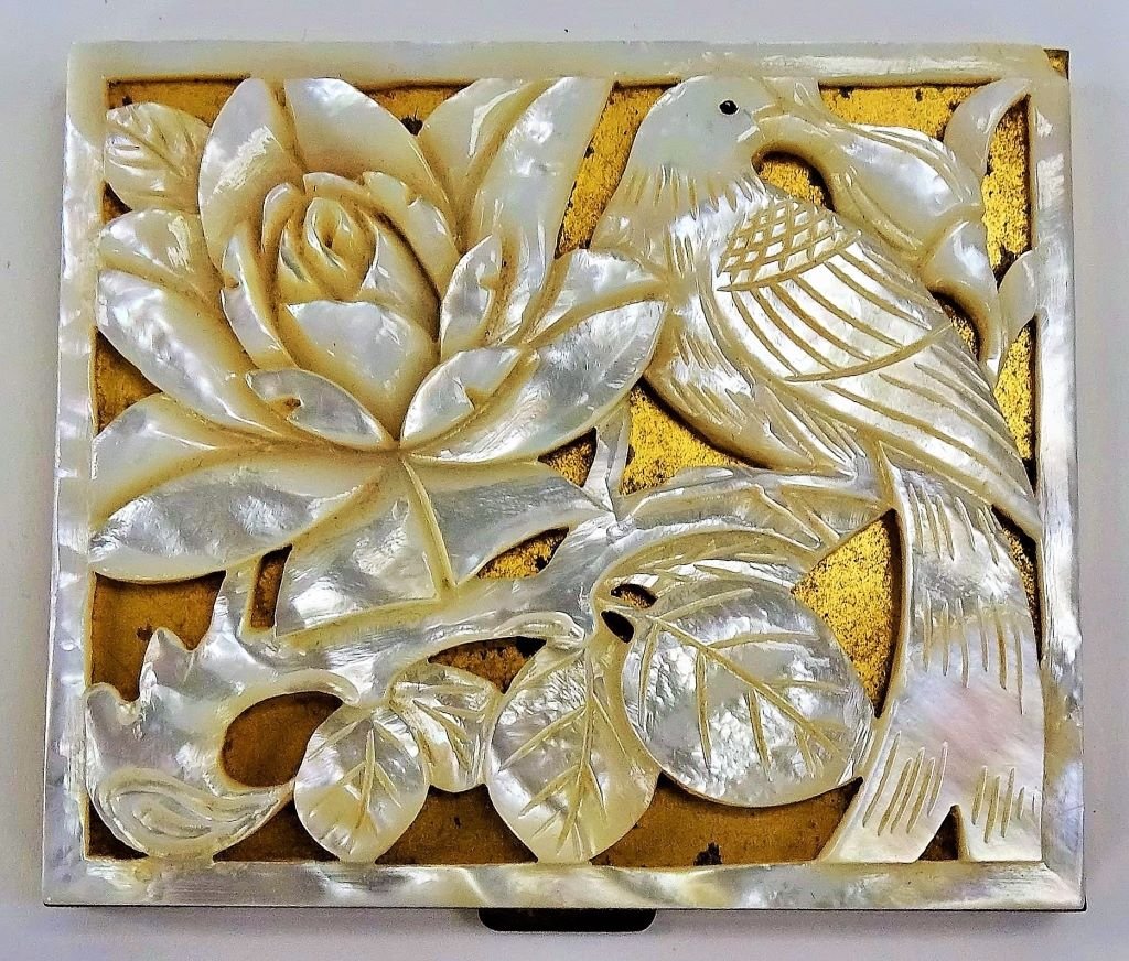VINTAGE DECO MOTHER OF PEARL COMPACT: Vintage mother of pearl compact deco with bag. Measures approx 2 1/2" tall x 2 3/4 " wide. Will ship for $25 U.S. plus insurance.