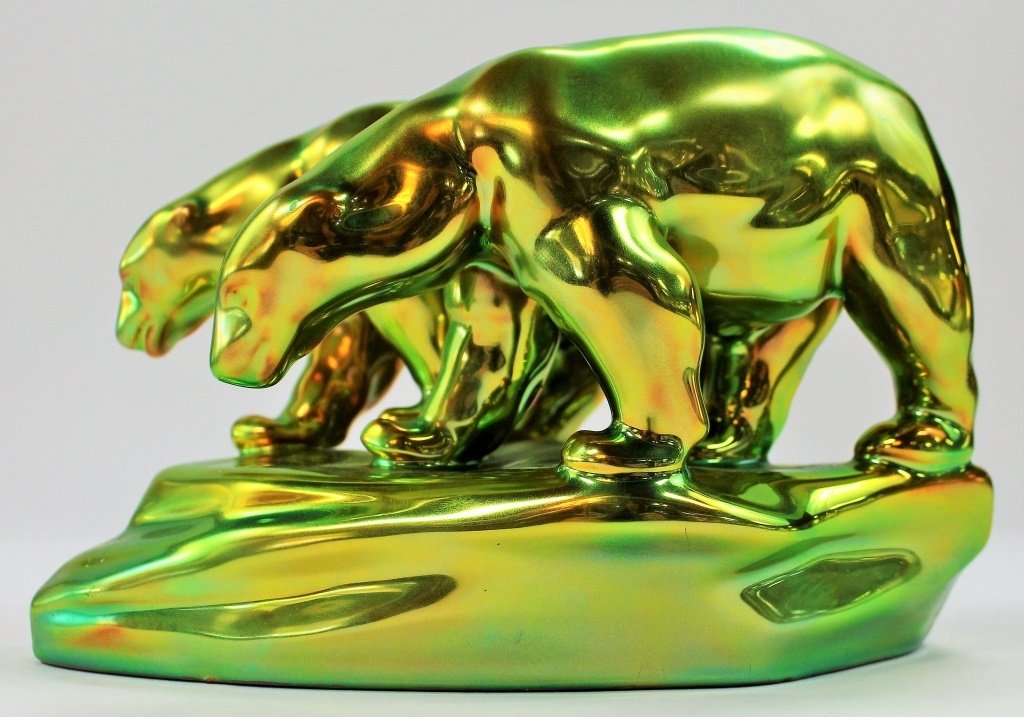 ZSOLNAY IRIDESCENT GLAZED POTTERY POLAR BEARS: Zsolnay Glazed Pottery Polar Bears. Made in Hungary. Measures approx 7" long x 5" tall. Will not ship can refer local shippers.