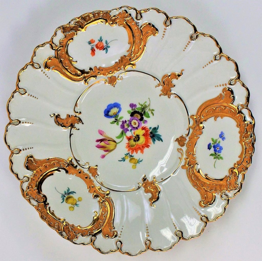 MEISSEN HAND PAINTED FLORAL PORCELAIN PLATE: Meissen hand painted porcelain floral plate with gold trim throughout. Bares the mark cross swords to bottom. Measures approx 9 1/4". Will not ship can refer our local shippers.