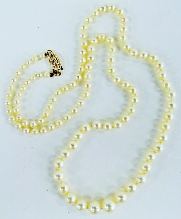 14KT YG AND POSSIBLY MIKI MOTO PEARL CHOKER: 19" long , with graduated pearls. with a total weight of 13.4 grams, shipping $20 plus ins u.s. will combine with other jewelry