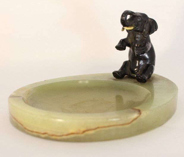 VINTAGE SPELTER ELEPHANT ONYX BASE ASHTRAY: 1930's spelter elephant on green onyx base ashtray. Measures approx 11" long. Will not ship can refer local shippers.