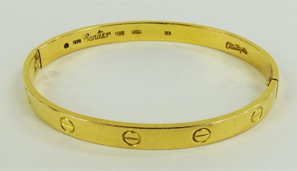 18KT CARTIER LOVE BRACELET ALDO CIPULLO LARGE SIZE: From a Palm Beach Estate. Beautiful signature 1970 18kt yellow gold Cartier Love Bracelet designed by Aldo Cipullo. Guaranteed authentic. No box, papers, or screw driver. We are offering the bracelet