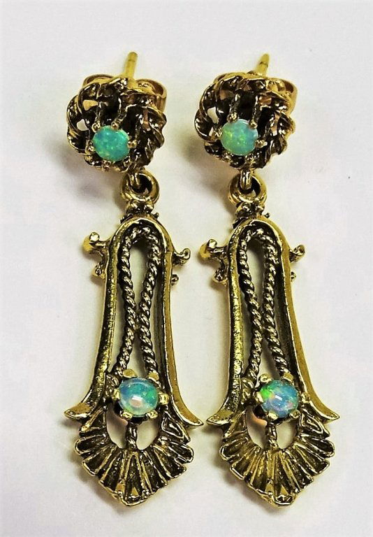 PAIR 14KT YELLOW GOLD OPAL DROP EARRINGS: Pair of 14kt Yellow Gold earrings set with (4) Round Cut Opals. Great classic design. Post backs marked 14K. Combined total weight of 5.4 grams. Shipping to be $20 + insurance in US.