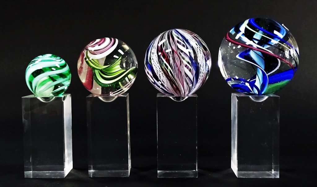 GROUP OF 4 SIGNED ART GLASS ORBS ON STANDS (1 of 3)
