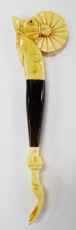 NANTUCKET FIGURAL CARVED BONE PIE KRIMPER: Early 20th century Nantucket figural carved bone pie crimper in the form of a horse. Also referred to as Marine Ivory this piece is carved from Whale Bone. Measures approx. 7.75" in length. Shipping t