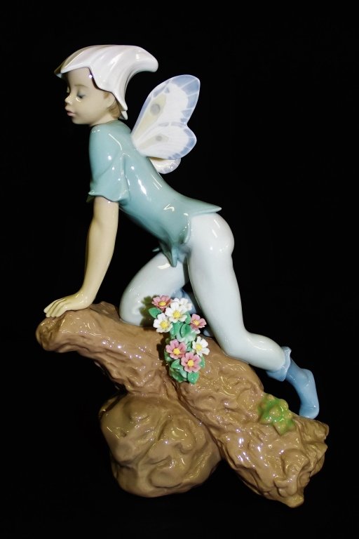 LLADRO PORCELAIN 'PRINCE OF THE ELVES' #7690: Lladro Spanish porcelain 'Prince of the Elves' figure #7690, issued in 2001, retired in 2003. Sculpted by Joan Coderch. Has glazed finish. Measures 9" H x 6 3/4" W. Will not ship, we can refer local s
