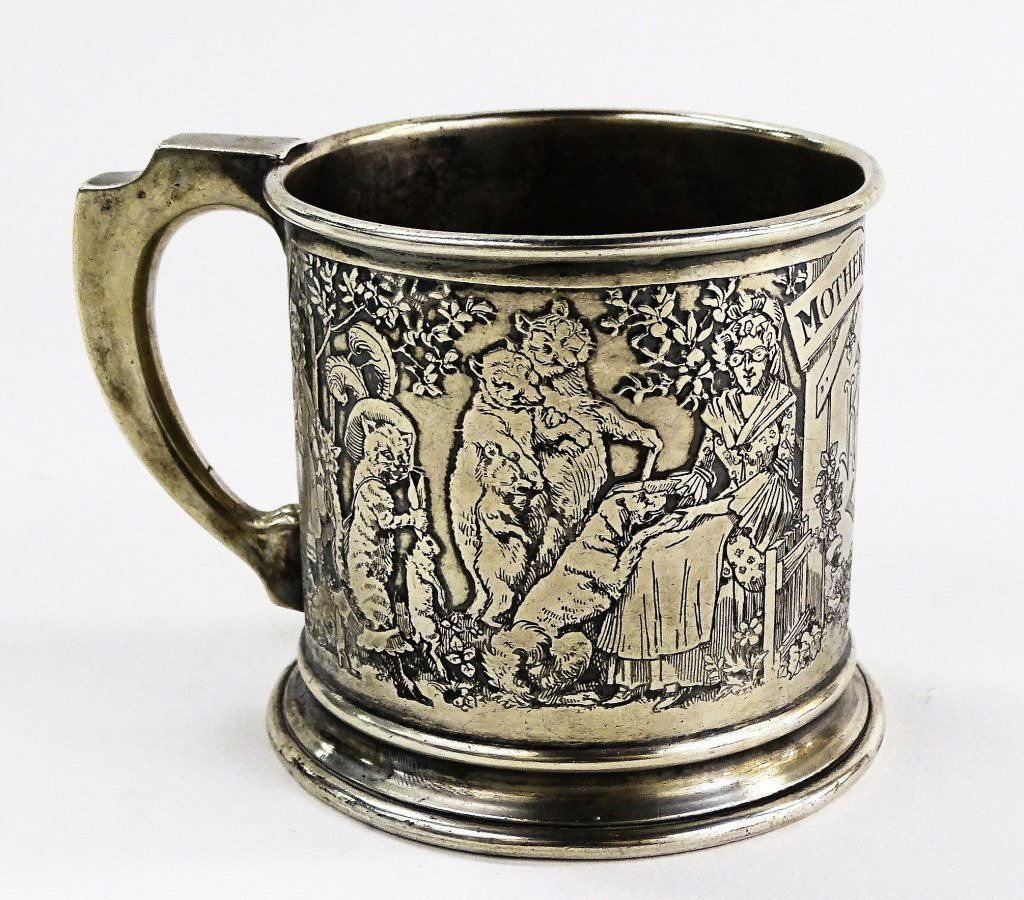 WILLIAM B. KERR STERLING SILVER BABY'S CUP: An antique Sterling Silver handled baby's cup by William B. Kerr & Co; Newark, NJ. Designed in an engraved Mother Goose fairy tale motif with depictions of Little Red Riding Hood, Puss in Boots, The T