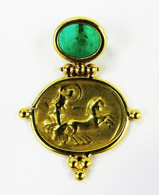 ITALIAN 18KT YELLOW GOLD & INTAGLIO GLASS PENDANT: Ladies' 18kt Yellow Gold hinged pendant. Designed in the style of a 405 - 400BC Italian coin accented by an oval shaped intaglio cut glass insert, with the etched depiction of a cherub scene. Hallmark
