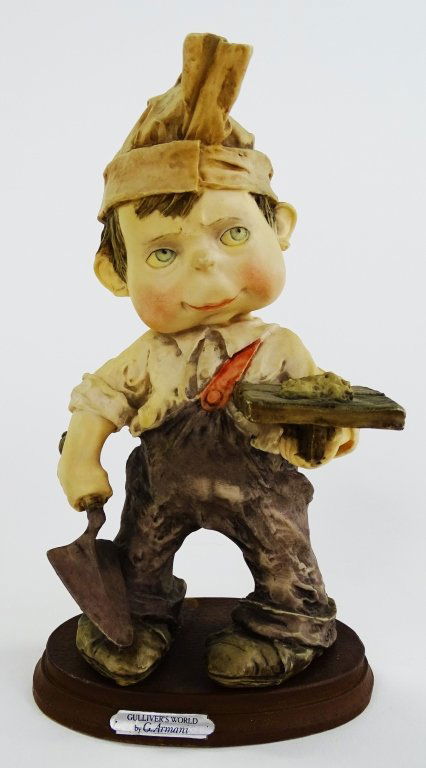 GIUSEPPE ARMANI FIGURINE OF A LITTLE BOY WORKING: Giuseppe Armani figurine of a little boy working. Measures approx 8 " tall. Will not ship can refer local shippers.
