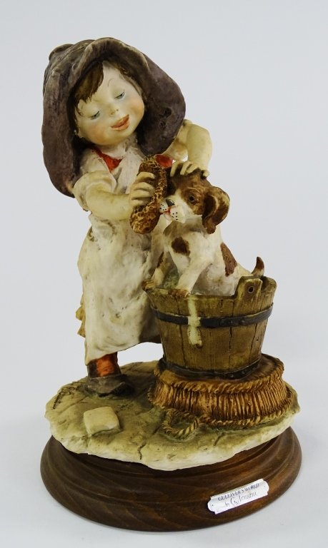 GUISEPPE ARMANI FIGURINE GIRL WASHING DOG: Guiseppe Armani figurine of a girl washing dog. Measures approx 9 " tall. Will not ship can refer local shippers.