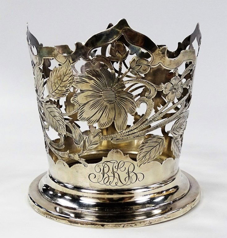 GORHAM STERLING SILVER WINE BOTTLE COASTER: Gorham sterling silver wine bottle coaster decorated with floral design through out. Measures approx 5" tall. Weighs approx 5.950ozt. Will ship for $25 U.S. plus insurance.
