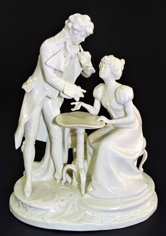 WHITE PORCELAIN CAPODIMONTE MAN AND WOMAN: Vintage white porcelain Capodimonte of a man and woman sitting at a table, marked to back. Measures approx 7" tall. Will not ship can refer local shippers.