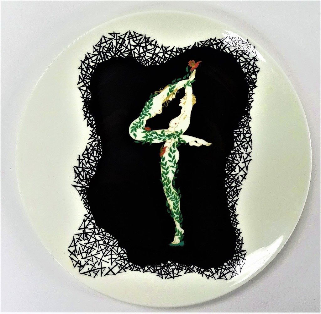 ERTE FOR MIKASA PORCELAIN 'THE NUMERALS - 4' PLATE: Erte for Mikasa Porcelain plate titled 'The Numerals - 4'. Measuring approx. 9" in diameter with the depiction of a nude male & female clad in Ivy vines, entwined together in the form of the number 4.
