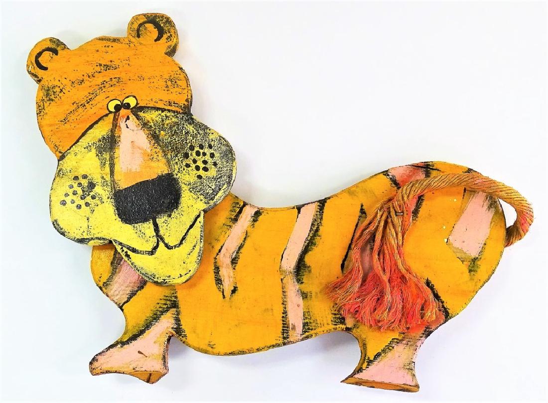 DAN SHUPE ORIGINAL MIXED MEDIA OF A CARTOON TIGER: Shupe, Dan (American, 20th); Original Mixed Media art depicting a cartoon tiger. Comprised of acrylic on wood with a painted rope tail. Signed to verso "Dan Shupe, USA". Measures approx. 15-1/2" H x 1