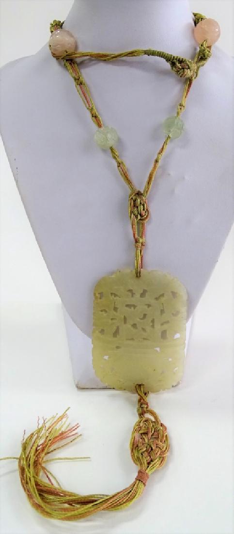 CHINESE ANTIQUE CARVED WHITE JADE PENDANT NECKLACE: Pendant is 3" long, nicely carved, attached with a rope necklace to smaller carved round beads, rope measures 24" long total weight of the pendant is 30 grams, shipping u.s. to be $20 plus ins