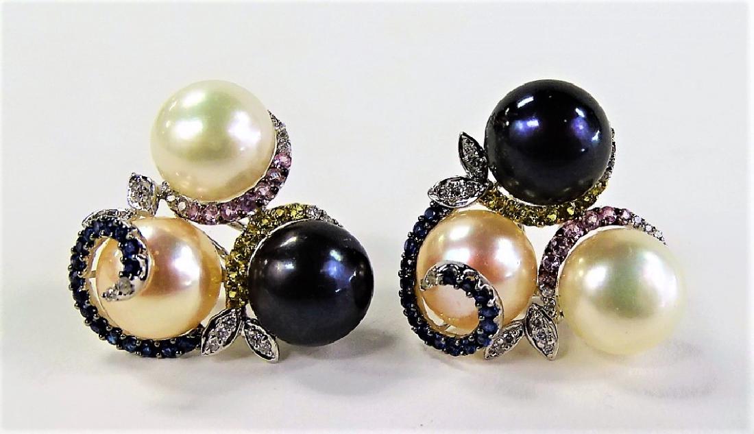 PR EXTRAVAGANT 14KT WG PEARL & SAPPHIRE EARRINGS: Pair of ladies' extravagant 14 karat White Gold cluster earrings, in floral motif design. Each set with one Saltwater Pearl, one Tahitian Pearl, and one Freshwater Pearl, all measuring approx. 11.11mm