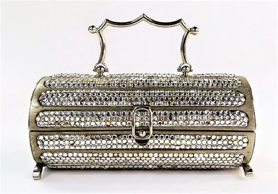 RARE JUDITH LEIBER METAL CRYSTAL MINIAUDIERE: Judith Leiber designed her first metal handbag in 1967 and started her line in 1963. This is a great piece, as it is earlier. The bag was designed in 1968. Measures approx 4' tall x 7" long. Will ship