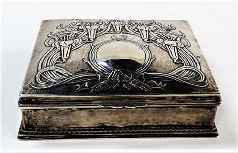 RARE ART NOUVEAU RAMSDEN & CARR STERLING BOX: An early 20th century English Sterling hinged box by Omar Ramsden & Alwyn Charles Ellison Carr. Done in Art Nouveau motif with scrolling florals and a central cartouche for monogram. Interior is fit w