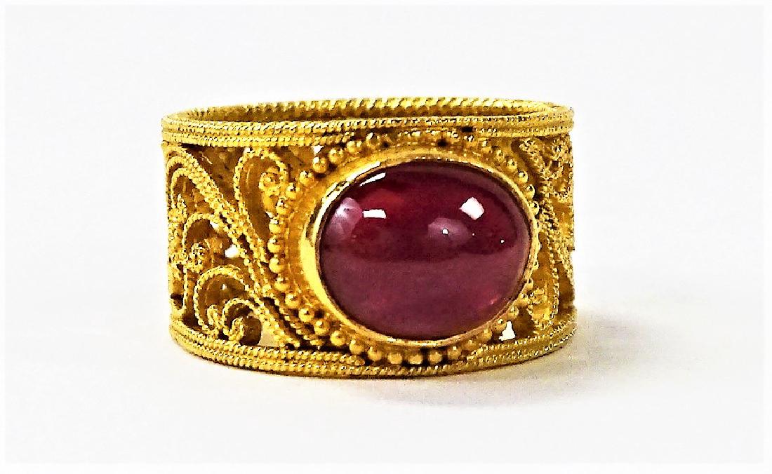 FRENCH 22KT Y GOLD & PIGEON BLOOD RUBY RING: Exquisite pierced band, size 6 1/2 with 2 ct cabochon ruby , this ring was owned by an Ambassadors wife, from Palm Beach. total weight of the ring is 11.2 grams, shipping u.s. to be $20 plus ins