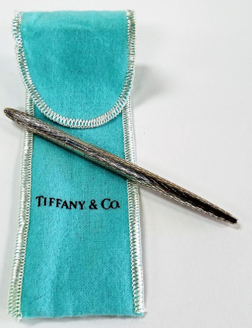 TIFFANY & CO STERLING SILVER PEN WITH POUCH: Measures 4 1/2" long, signed with a total weight of 12.5 grams, shipping $20 plus ins u.s.