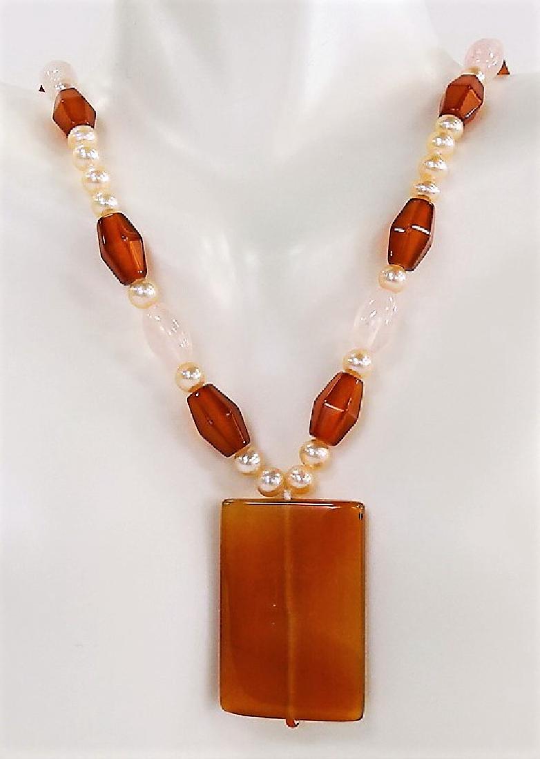 14KT Y GOLD CARNELIAN AND PEARL NECKLACE: Measures 18" long, with gold clasp. from a local estate, dates to the 1960's' shipping $20 plus ins u.s