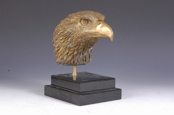 A Bronze Eagle Head Mounted on a Granite Base