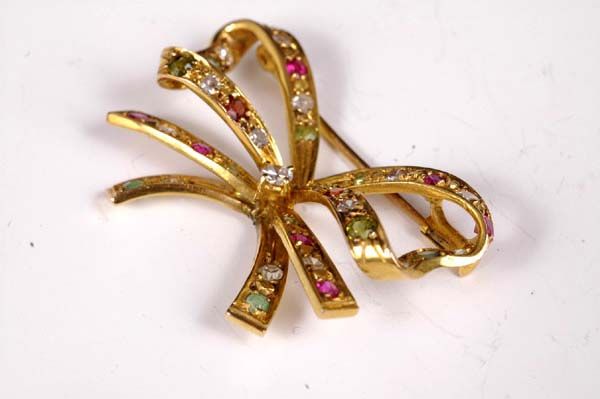 Exquisite 18kt Gold Bow Pin with Precious Stones