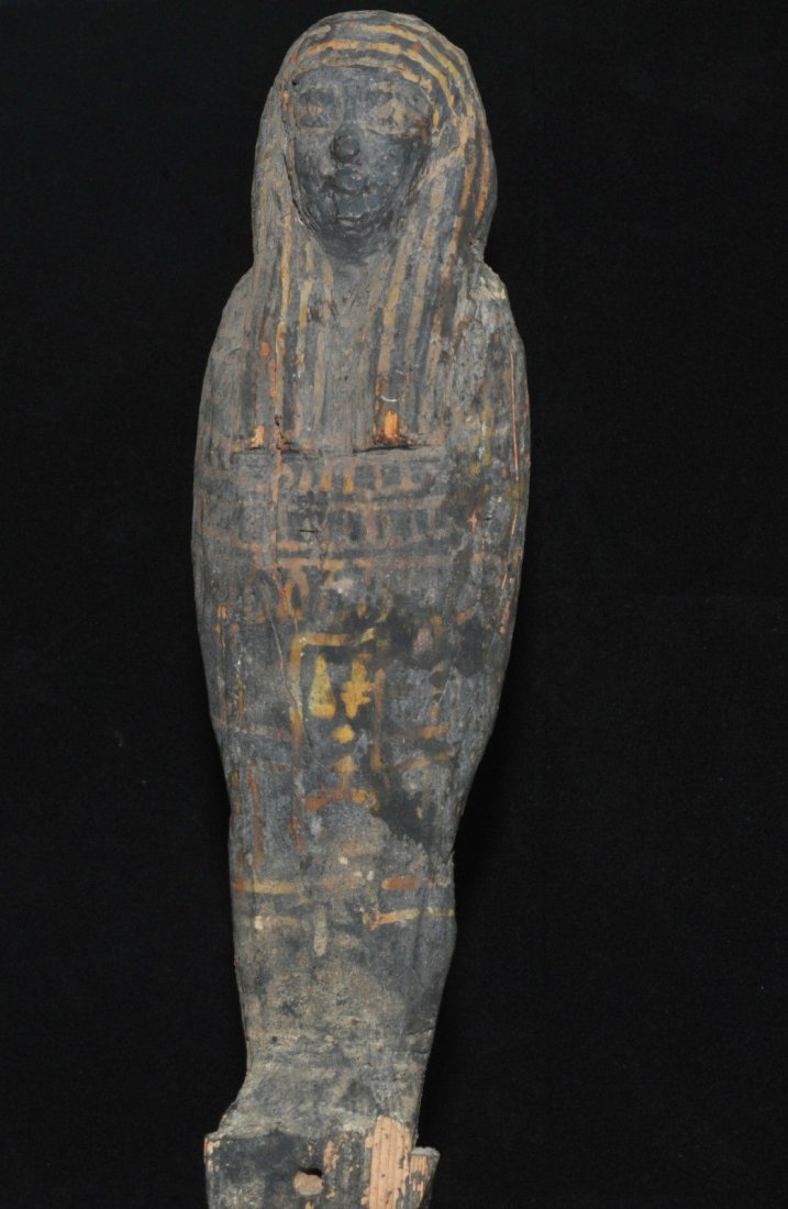 ANCIENT EGYPTIAN WOODEN PTAH SOKAR OSIRIS STATUE: Features an exceptional wooden glaze. Examples of this uncommon style tend to be more sought after on the market, when they become made available. Circa 746 B.C. Measurements: 11 3/4 in. H. (29.8 cm.)