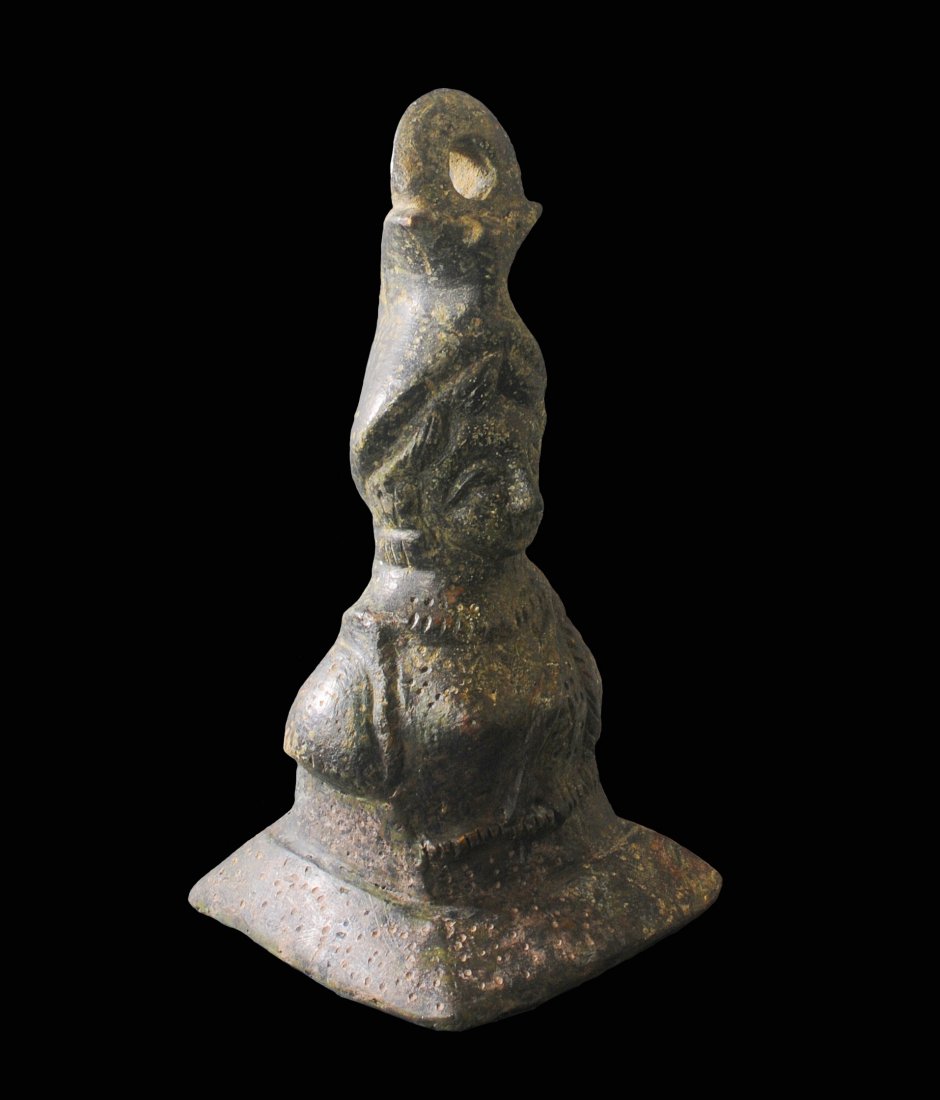 ANCIENT EARLY BYZANTINE BRONZE STEELYARD WEIGHT: This steelyard weight is in the form of a bust of Athena. A nice, sizable example. Particularly rare in this size. Circa 6th-7th Century A.D. Measurements: 7 1/4 in. H. (18.5 cm.) Ex: Italian private 