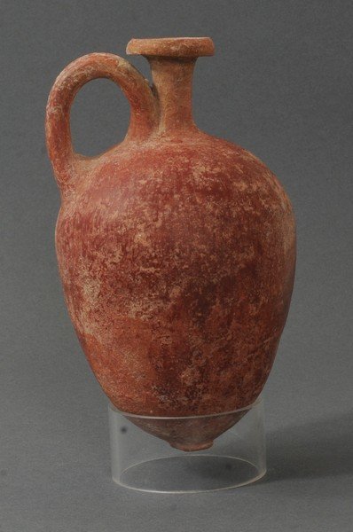 APHRODITE AUCTION #3- RED GLAZED TERRACOTTA AMPHORA: Circa 800-600 B.C. Measurements: 6 1/4 in. H. (15.9 cm.) Ex: Prominent French private collection, 1970s. Ex: European art market, 1980s; Ex: New Jersey private collection, 1990s.Single handed, with a