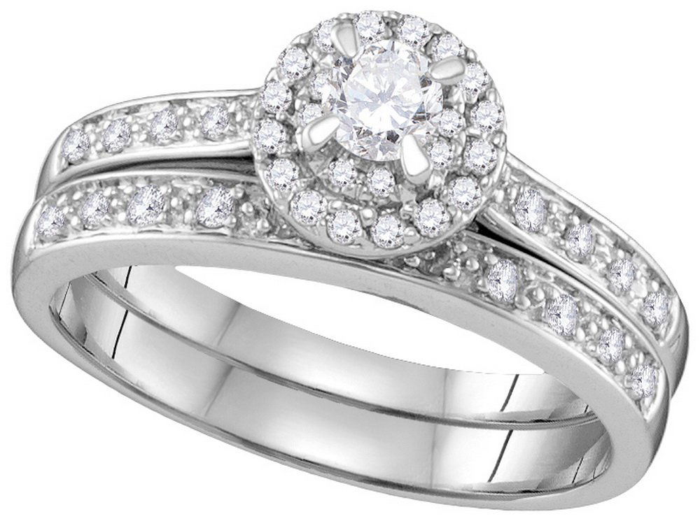 0.71 CTW Diamond Bridal Set Ring 14KT White Gold -: REF#77G3MManufacturer's Suggested Retail Price: $3000.00Stone 2: DiamondStone Carat Total Weight: 0.71 ctwMetal Type: 14KT White GoldProduct Type: Bridal Set Ring0.71 CTW Diamond Bridal Set Ring 14KT