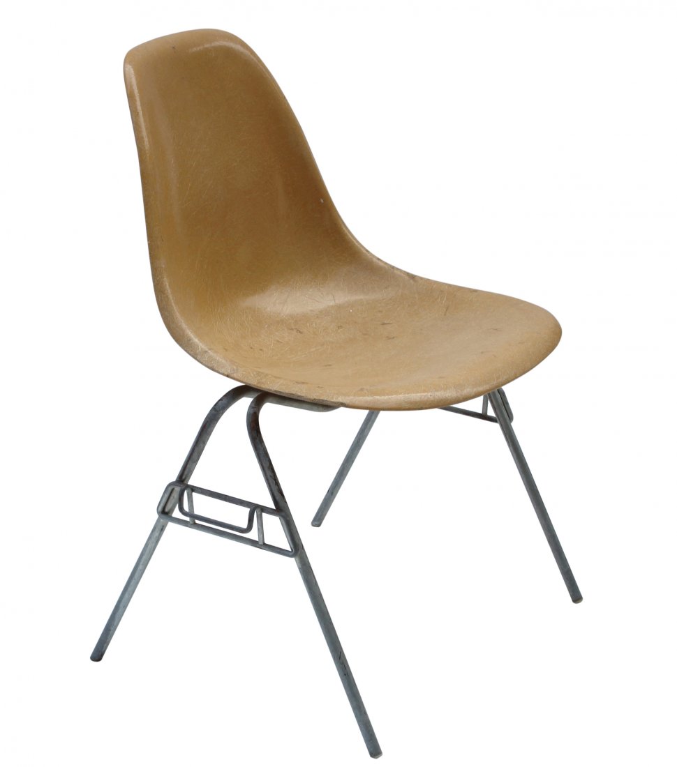 Herman Miller Fiberglass Shell Chair Mid-Century Modern: Herman Miller marked fiberglass yellow chair with metal frame and base. Mid-century modern chair. Herman Miller logo/mark can be found in the fiberglass mold on the bottom.Size: 31 in. h., 21 in. wide