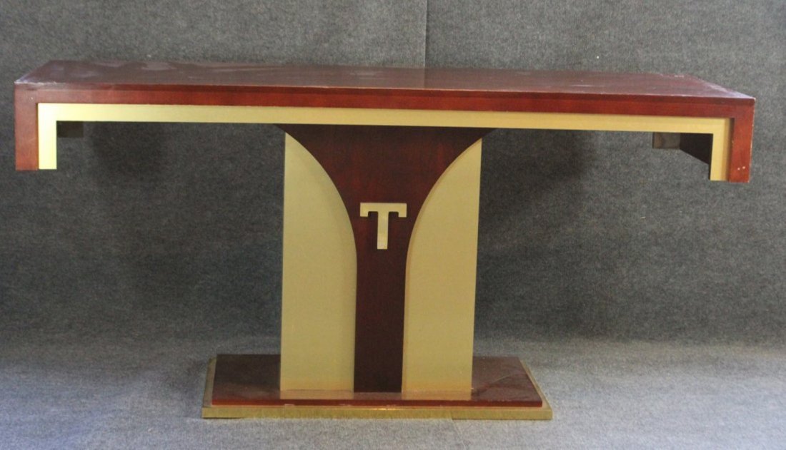 TRUMP CONSOLE TABLE - ATLANTIC CITY TRUMP PLAZA CASINO: TRUMP CONSOLE TABLE - ATLANTIC CITY TRUMP PLAZA CASINO. Known as the "T" Table. High quality furniture in mahogany, brass and gold gilt.Size: 34.5"h x 72"w x 24"dpossible use: can be used as a bar wit