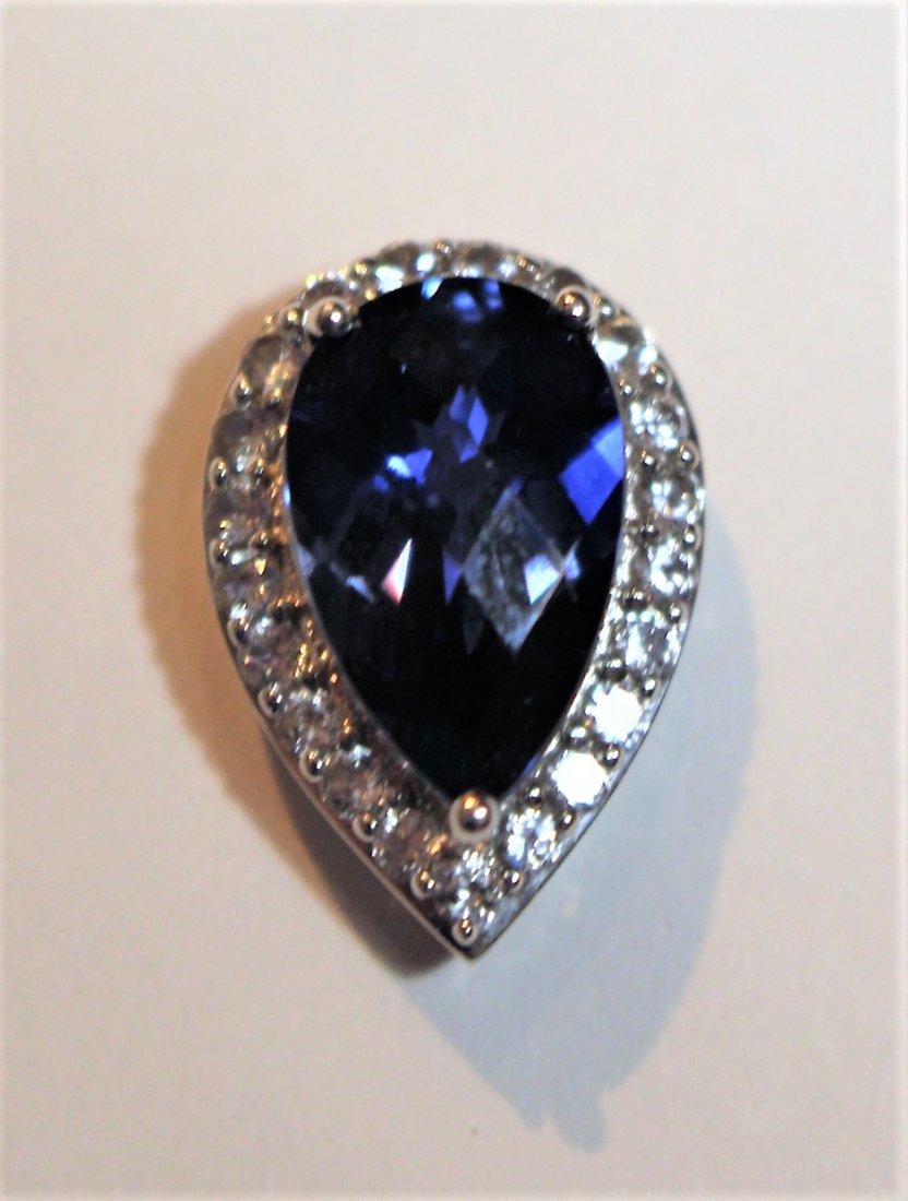 10 K White Blue Sapphire Pendant With CZs: 10 K White Gold Blue Sapphire Pendant With CZs. Size: 3/4 in. x 1/2 in.pendant only, no chain.