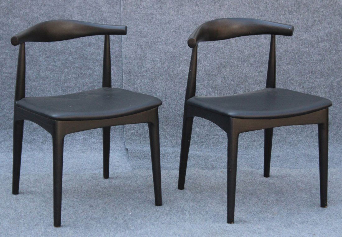 PAIR HANS WEGNER DESIGN OXBOW BACK CHAIRS [later]: PAIR HANS WEGNER DESIGN OXBOW BACK CHAIRS [later]. Black ebony finish, very clean.Size: 29 h , 20 w