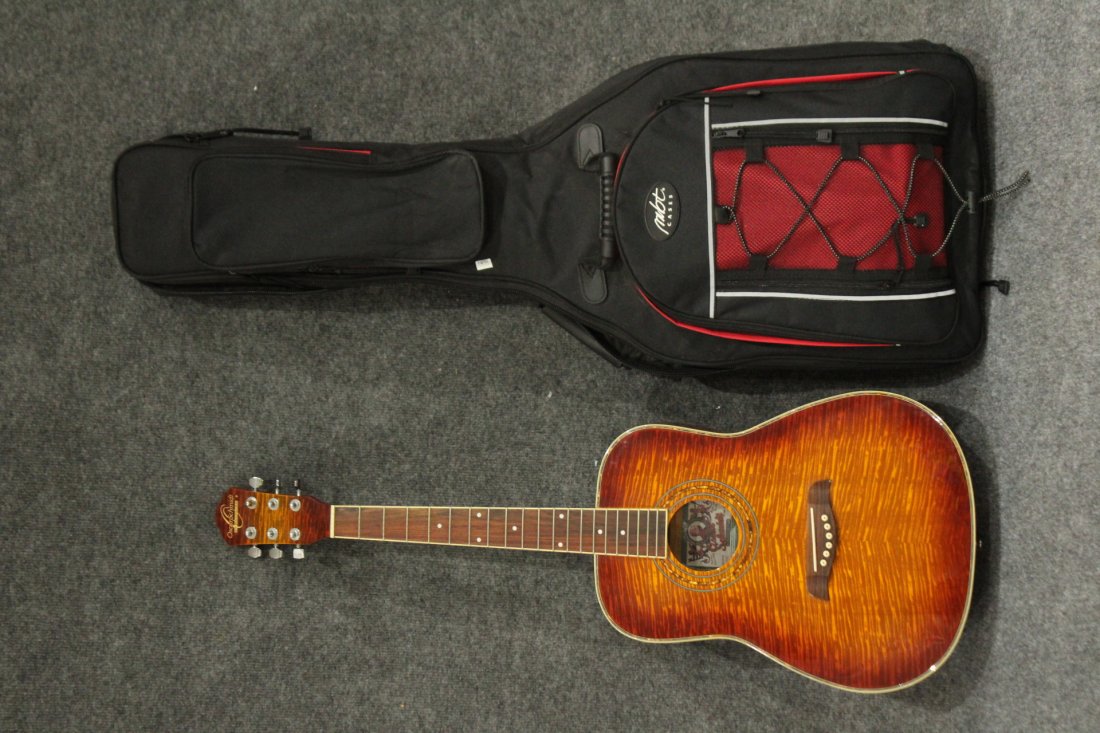 Oscar Schmidt Acoustic Guitar Autographed MICHAEL LANG: Oscar Schmidt Acoustic Guitar, Model: OGIFYS . Hand crafted with tiger maple body. Guitar has no strings Comes with case. Autographed ny MICHAEL LANG, Woodstock Music Festival Promoter. Size: 37 h
