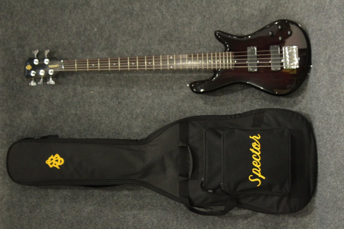 Spector 5 Five string Bass guitar "NEW": Spector 5 Five string Bass guitar in almost brand new condition ( plastic covers are still on pick-ups. Guitar has a dark stain tiger maple body. comes with a soft case. Size: 45 h