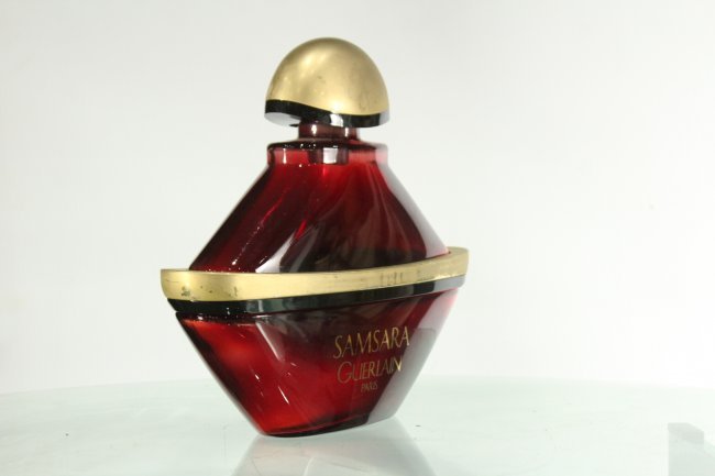 Samsara Guerlain Paris Glass Cologne Bottle: Samsara Guerlain Paris Glass Cologne Bottle with stopper and accented body ringSize: 10.5 h ,