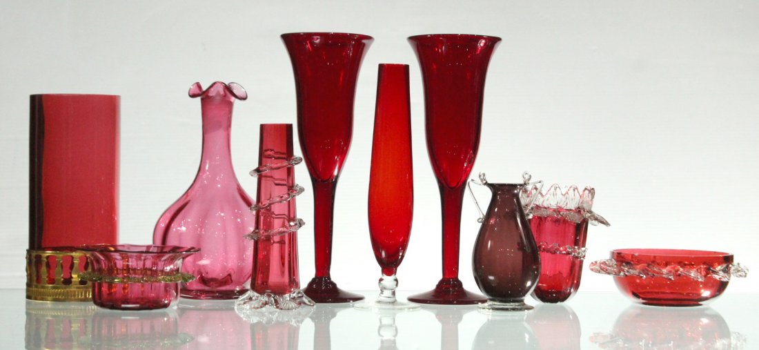 10 Assorted Grouping of CRANBERRY GLASS / RUBY GLASS: Estate collection of red glass consisting of wine glasses, hand blown items, dishes, tulip vases, and other decorative glass. Other present colors, cranberry red, purple, ruby, pink, gold, neon yellow