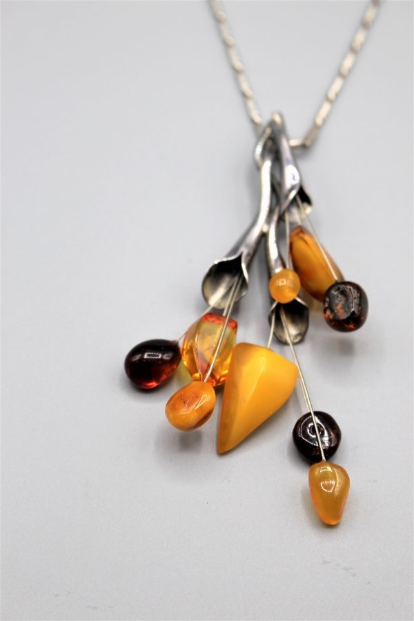 CALLA LILLY STERLING BAKELITE PENDANT On STERLING CHAIN: CALLA LILLY STERLING BAKELITE PENDANT On STERLING CHAIN. pendant: 3.75 in. x 1.75 in. ; 23 in. length chain.