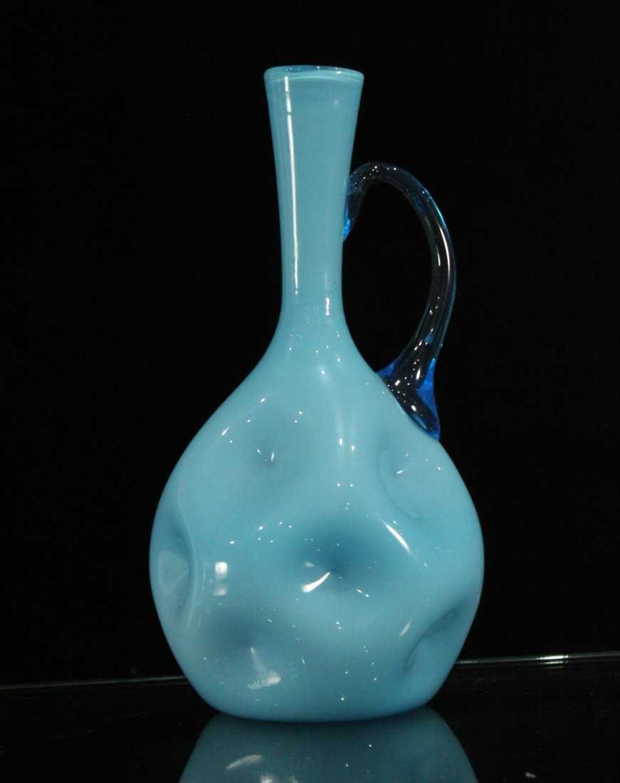 OPAQUE BLUE GLASS PITCHER PINCHED SIDES: OPAQUE BLUE GLASS PITCHER PINCHED SIDES, hand blown glass Size: 12.5 \" h
